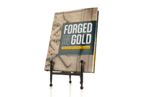 Photo of book cover of Forged in Gold